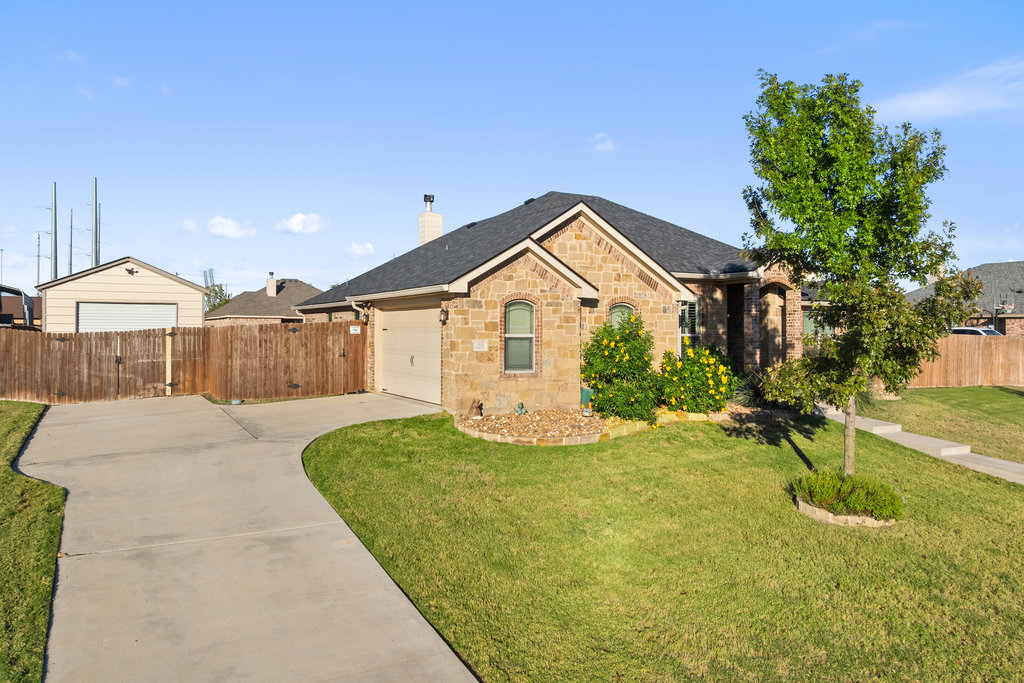 153 Ranger Boulevard Salado, TX 76571 - Photo 6 of 40 a front view of a house with a yard and garage