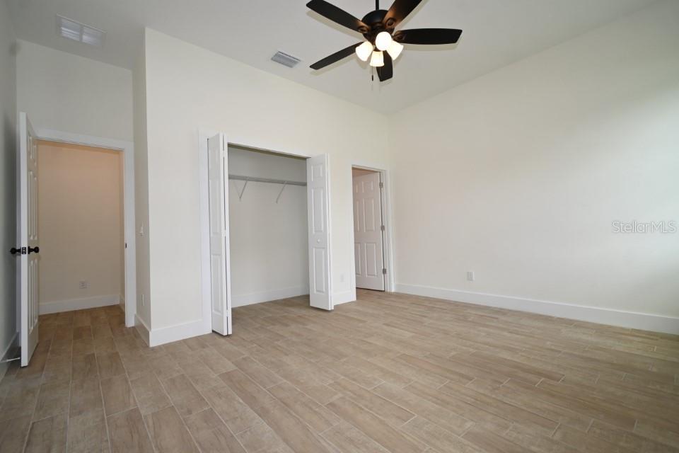 36755 Thomas Jefferson Road Dade City, FL 33525 - Photo 15 of 33 wooden floor in an empty room