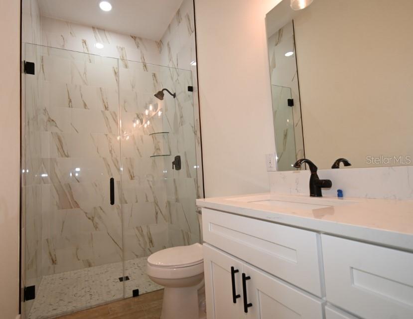 36755 Thomas Jefferson Road Dade City, FL 33525 - Photo 18 of 33 a bathroom with a sink a toilet and shower