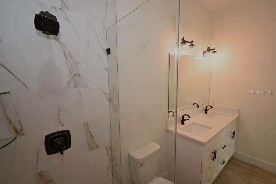 36755 Thomas Jefferson Road Dade City, FL 33525 - Photo 19 of 33 a bathroom with a sink and a mirror