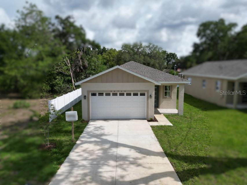 36755 Thomas Jefferson Road Dade City, FL 33525 - Photo 33 of 33 a view of a house with a yard