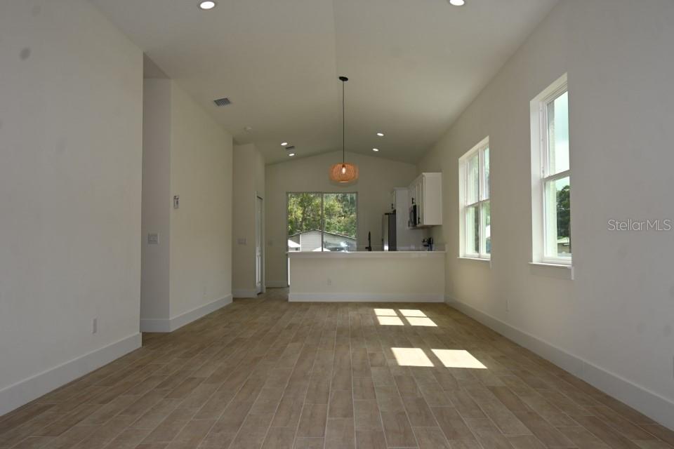 36755 Thomas Jefferson Road Dade City, FL 33525 - Photo 4 of 33 wooden floor in an empty room with a window