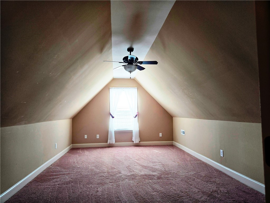 304 Knoll View Drive Seneca, SC 29678 - Photo 23 of 36 This spacious attic room offers comfort and potential for versatile use.