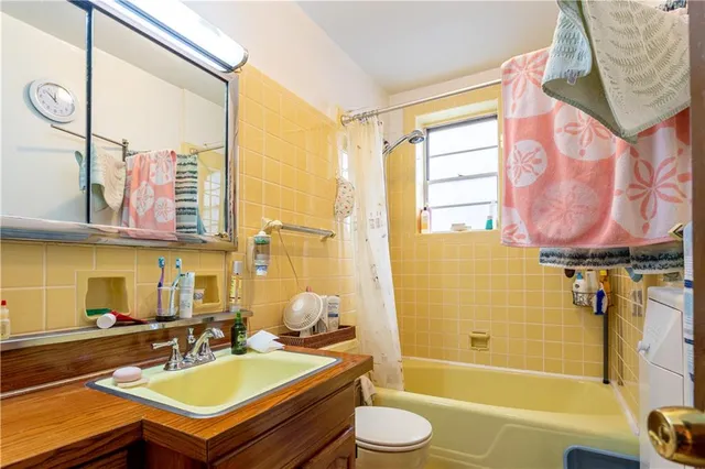 a bathroom with a sink a bathtub and a toilet