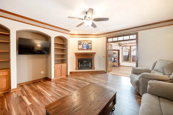 a living room with furniture and a fireplace