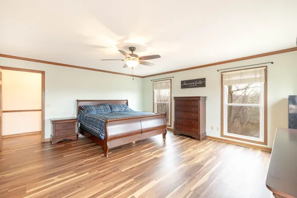a bedroom with bunk bed and a chandelier