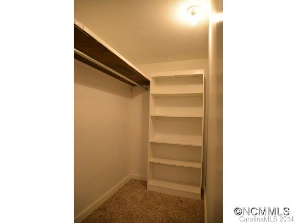 40 Lyle Street Tryon, NC 28782 - Photo 12 of 16 a view of walk in closet with empty racks
