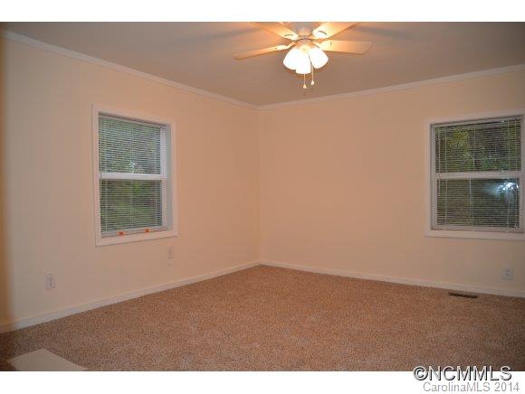 40 Lyle Street Tryon, NC 28782 - Photo 13 of 16 a view of an empty room with a window