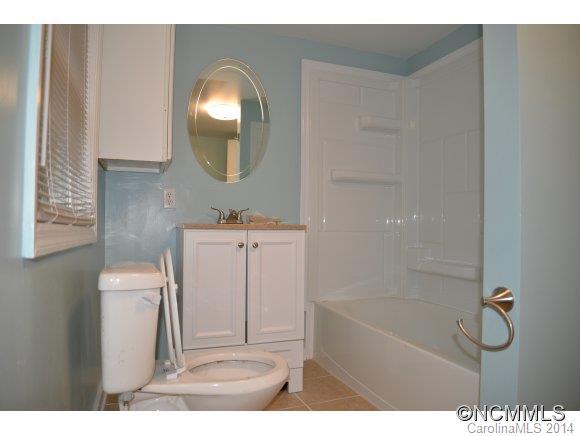 40 Lyle Street Tryon, NC 28782 - Photo 15 of 16 a bathroom with a sink toilet and shower