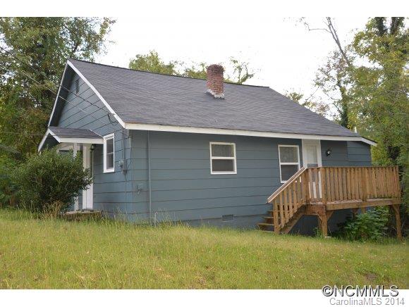 40 Lyle Street Tryon, NC 28782 - Photo 3 of 16 a view of a house with a yard