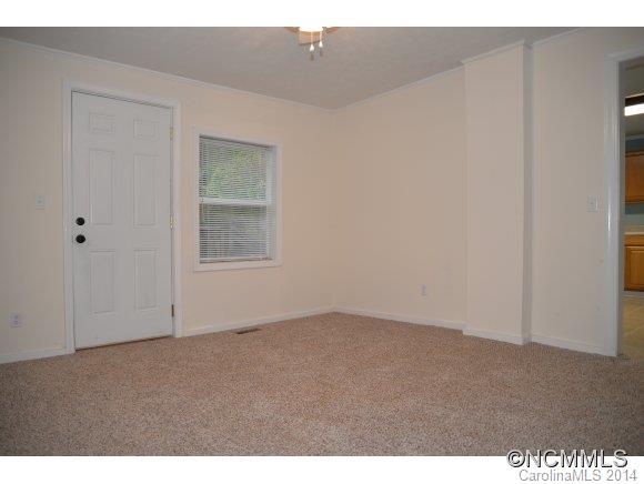 40 Lyle Street Tryon, NC 28782 - Photo 7 of 16 a view of an empty room and window