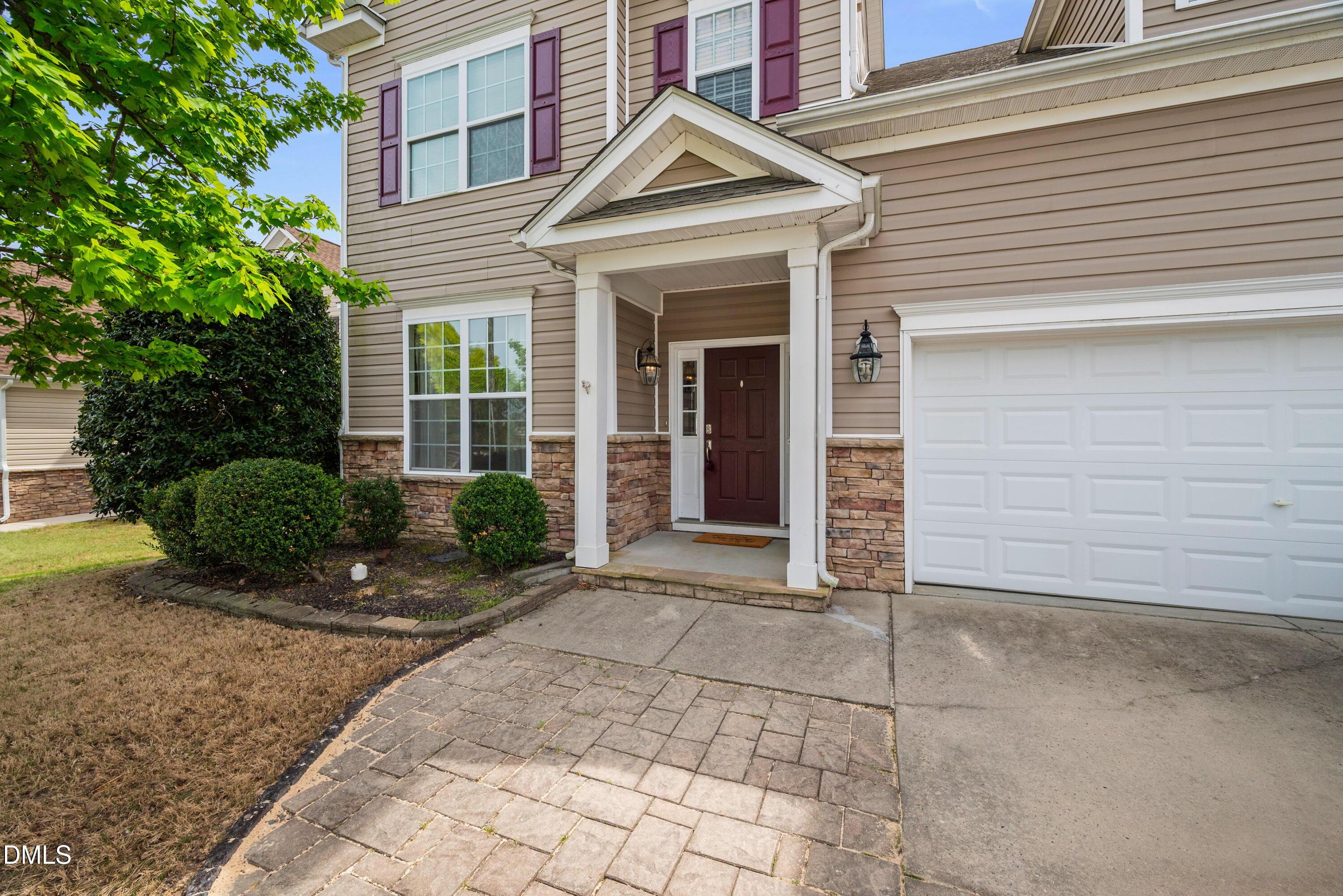 5304 Stone Station Drive Raleigh, NC 27616 - Photo 3 of 34 a view of a house with a yard and potted plants