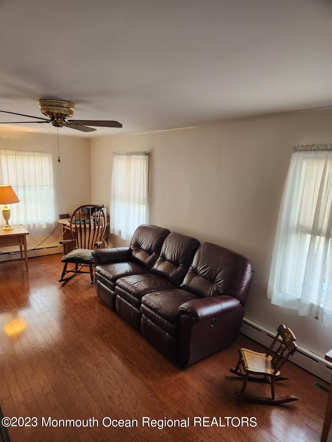 14 Grove Street Long Branch, NJ 07740 - Photo 11 of 21 a living room with furniture rug and a window