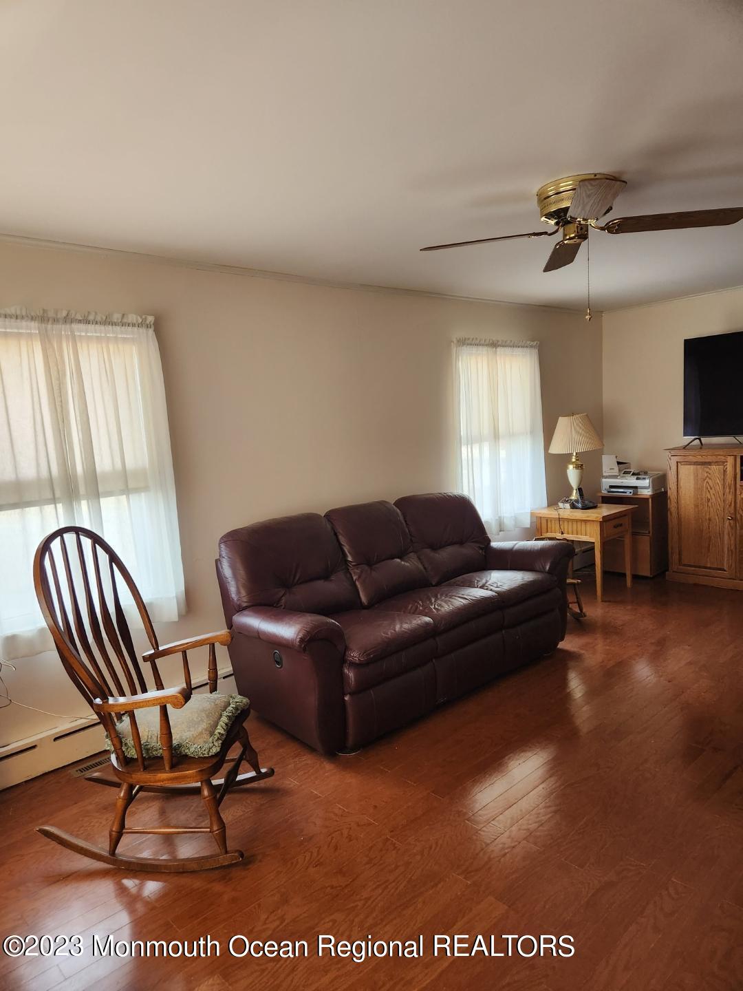 14 Grove Street Long Branch, NJ 07740 - Photo 12 of 21 a living room with furniture a ceiling fan and a rug