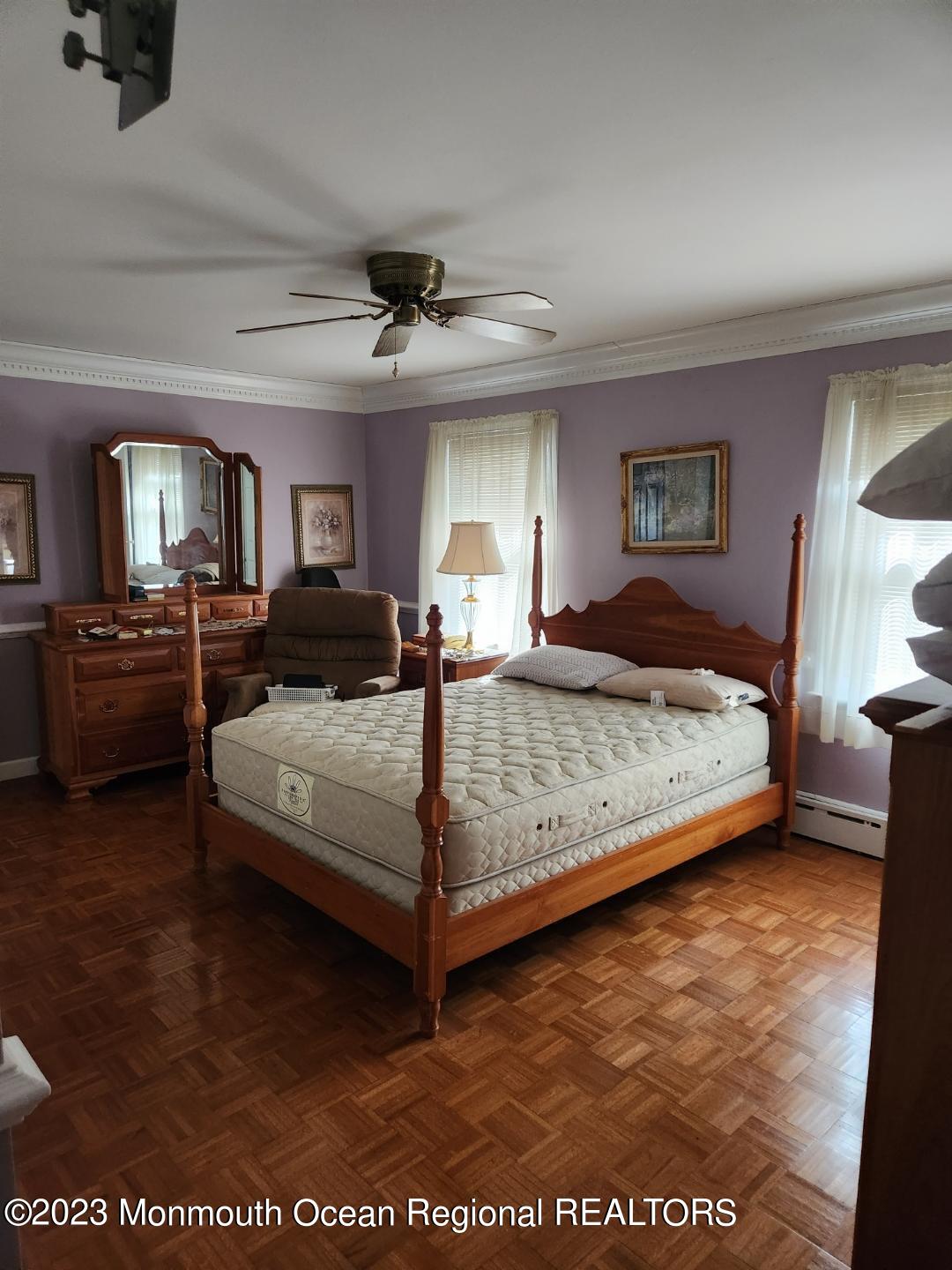 14 Grove Street Long Branch, NJ 07740 - Photo 15 of 21 a bedroom with a large bed and a tv