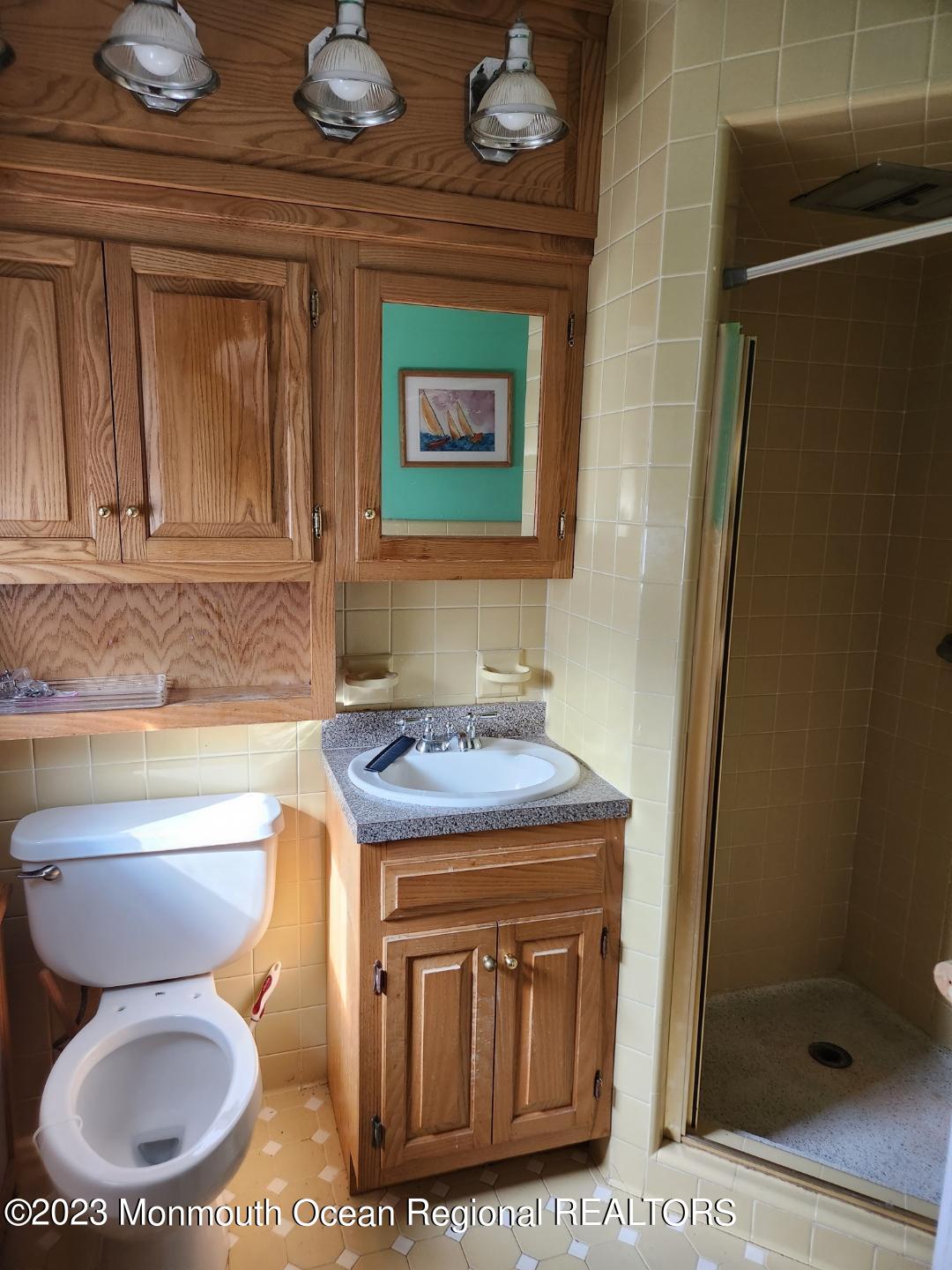 14 Grove Street Long Branch, NJ 07740 - Photo 16 of 21 a bathroom with a toilet a sink and a shower