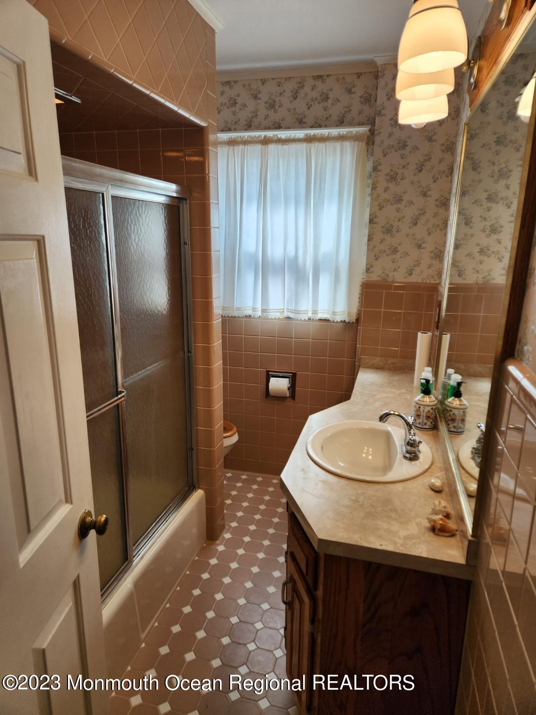 14 Grove Street Long Branch, NJ 07740 - Photo 17 of 21 a bathroom with a sink a toilet and shower