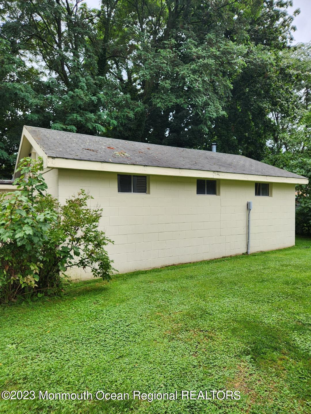 14 Grove Street Long Branch, NJ 07740 - Photo 20 of 21 a view of a backyard with plants and large trees