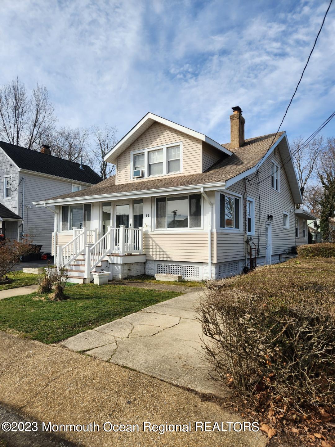14 Grove Street Long Branch, NJ 07740 - Photo 5 of 21 a front view of a house with a garden