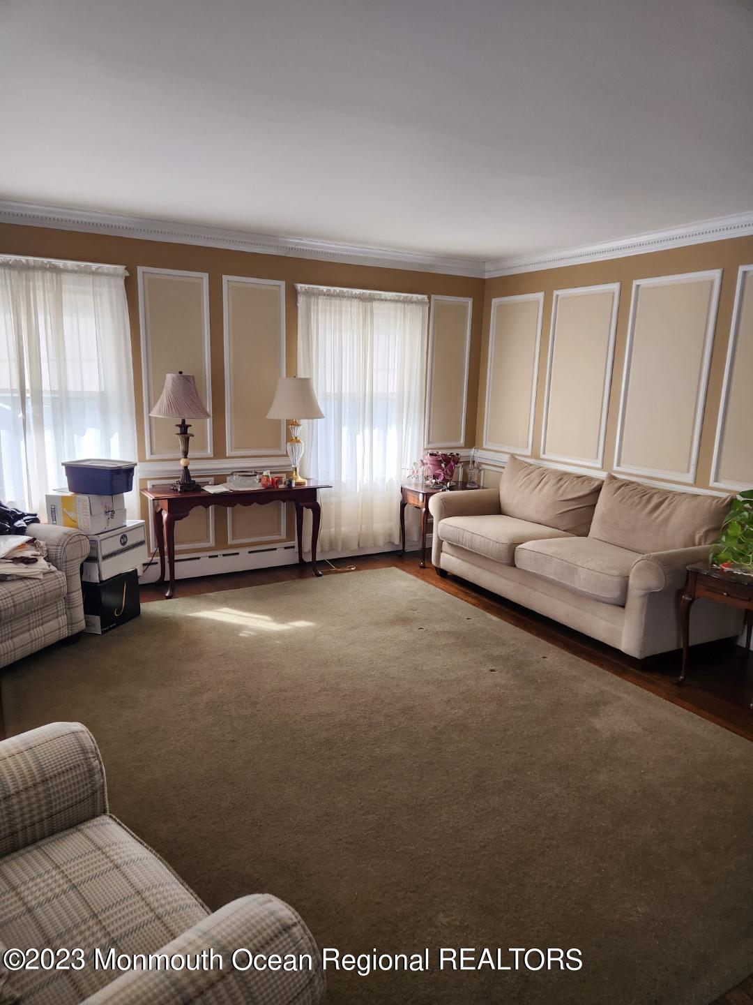 14 Grove Street Long Branch, NJ 07740 - Photo 6 of 21 a living room with furniture and a large window