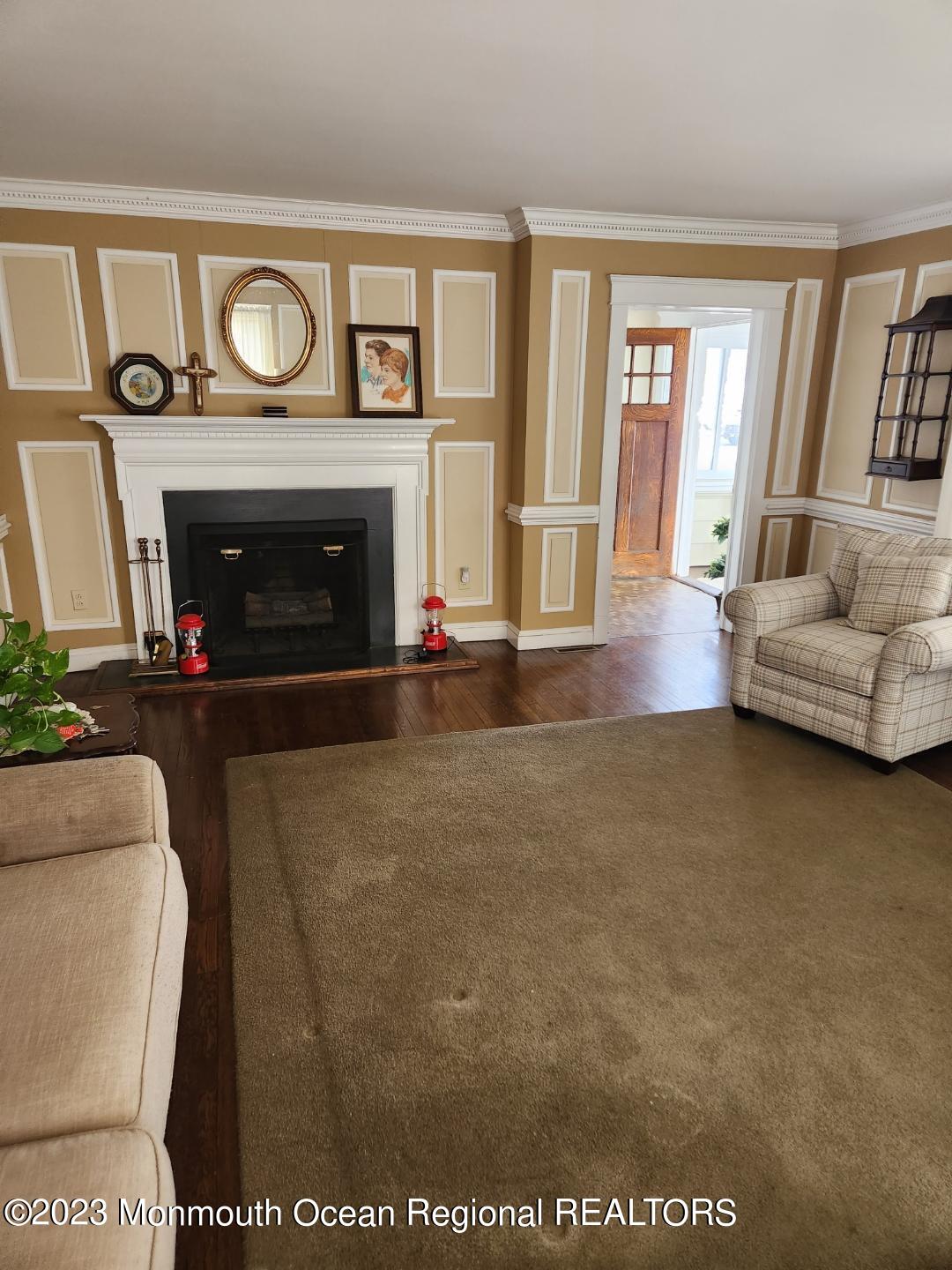 14 Grove Street Long Branch, NJ 07740 - Photo 7 of 21 a living room with furniture and a fireplace
