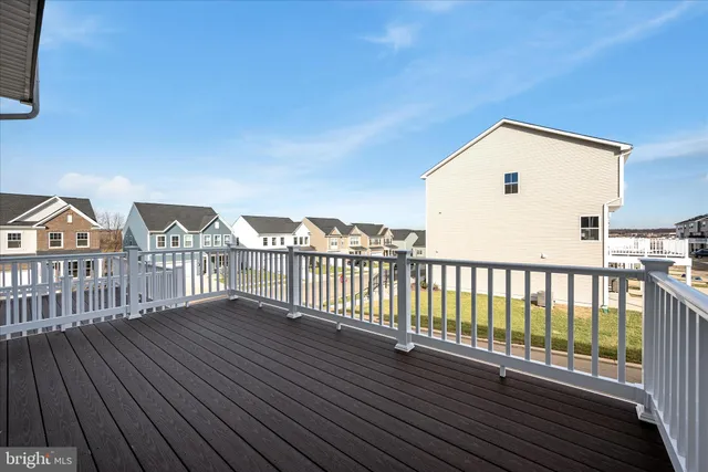 a view of a house with wooden deck
