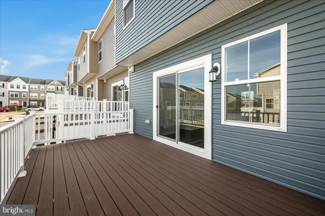 a view of a balcony with wooden floor