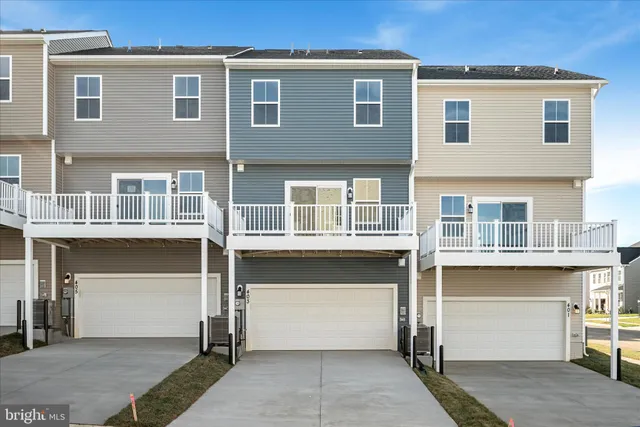 a front view of a building with a garage