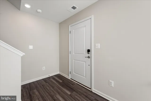 a view of room with wooden floor