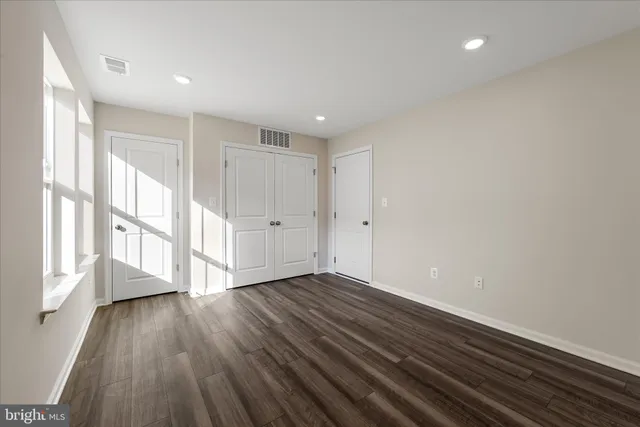 a view of entryway with wooden floor