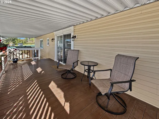 a view of a chairs and table in patio