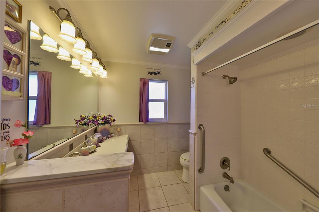 109 Satsuma Drive Altamonte Springs, FL 32714 - Photo 13 of 20 a bathroom with a sink a toilet and shower