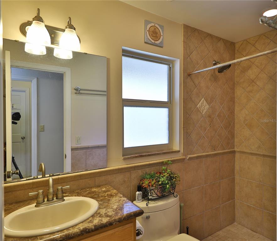 109 Satsuma Drive Altamonte Springs, FL 32714 - Photo 14 of 20 a bathroom with a sink and a mirror