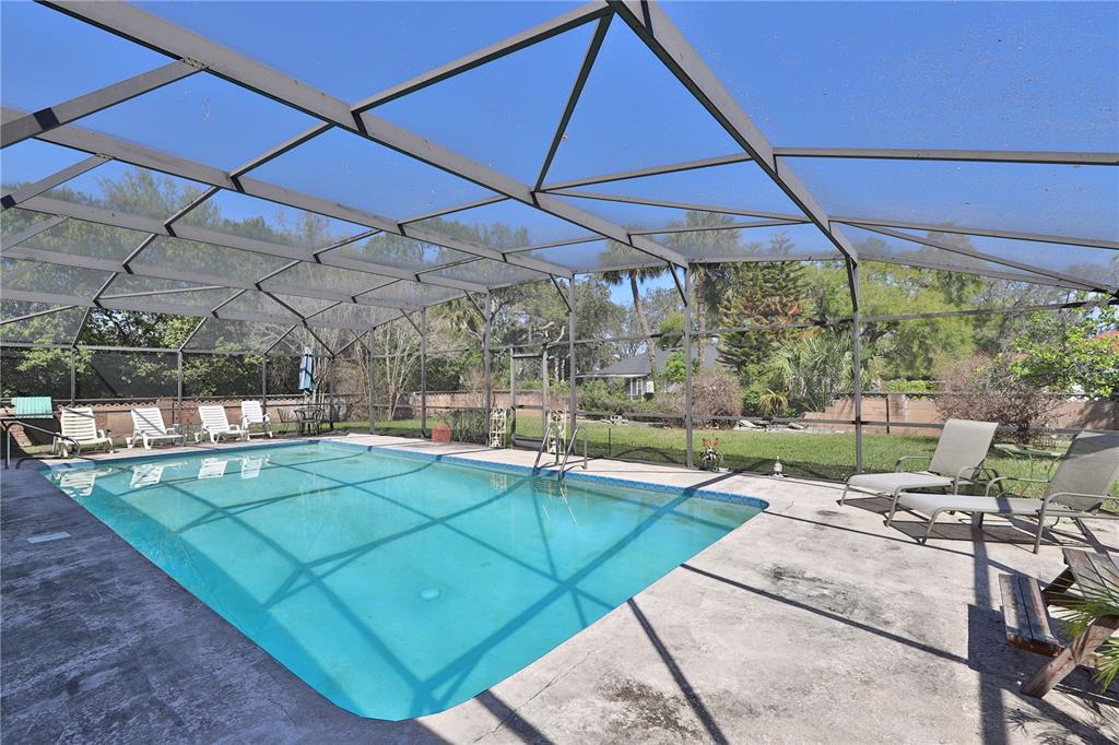 109 Satsuma Drive Altamonte Springs, FL 32714 - Photo 16 of 20 a view of a backyard with a patio and fire pit