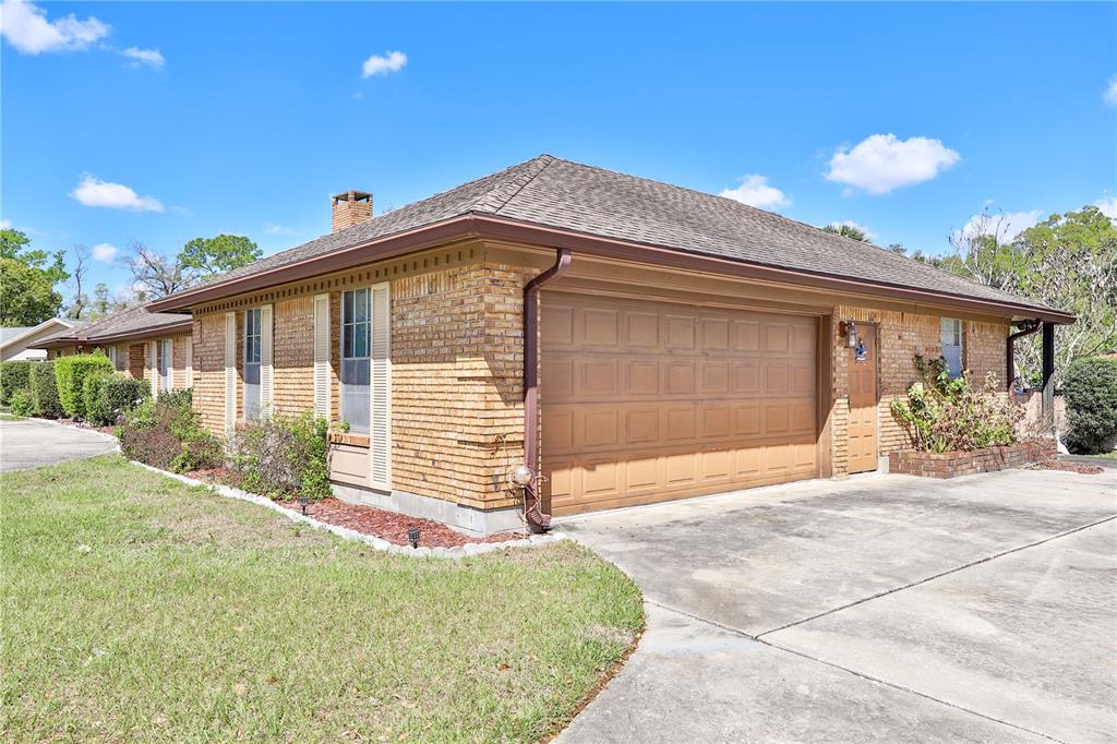 109 Satsuma Drive Altamonte Springs, FL 32714 - Photo 19 of 20 a front view of a house with a garage