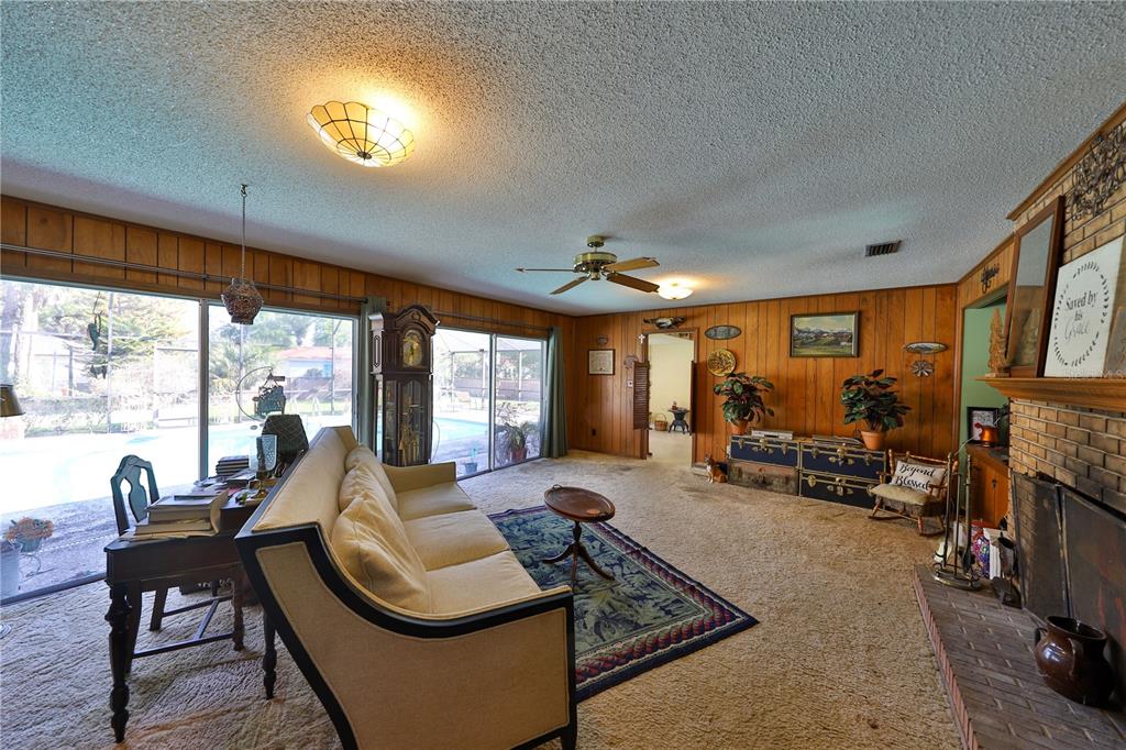 109 Satsuma Drive Altamonte Springs, FL 32714 - Photo 4 of 20 a living room with furniture and large windows