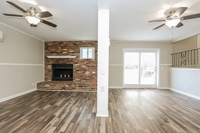 a view of fireplace and wooden floor