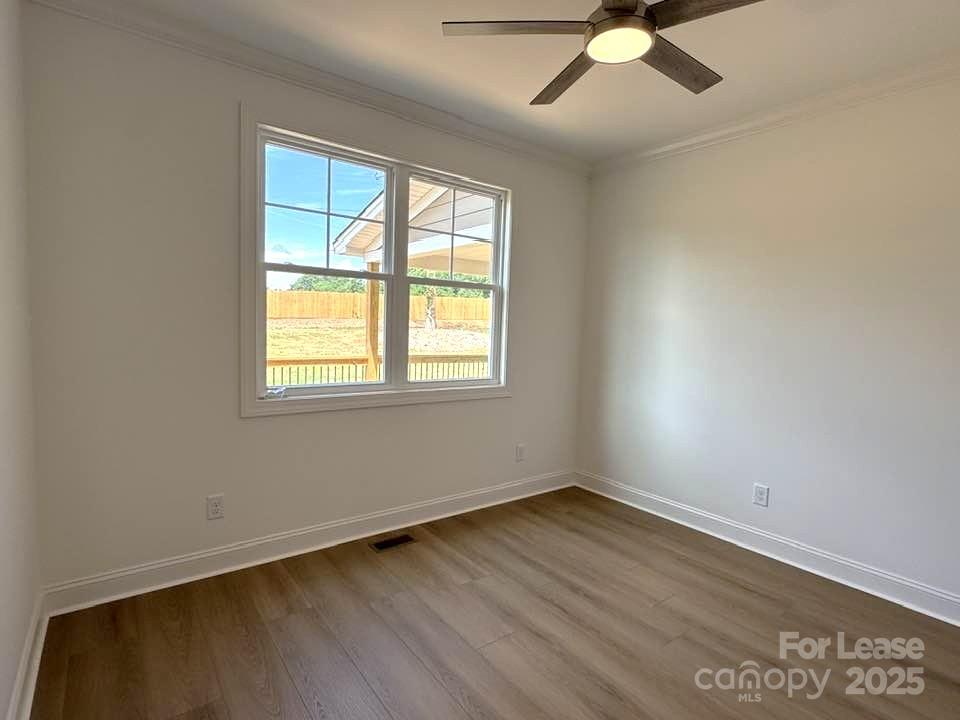 8070 Blackwood Road Denver, NC 28037 - Photo 26 of 39 wooden floor in an empty room with a window