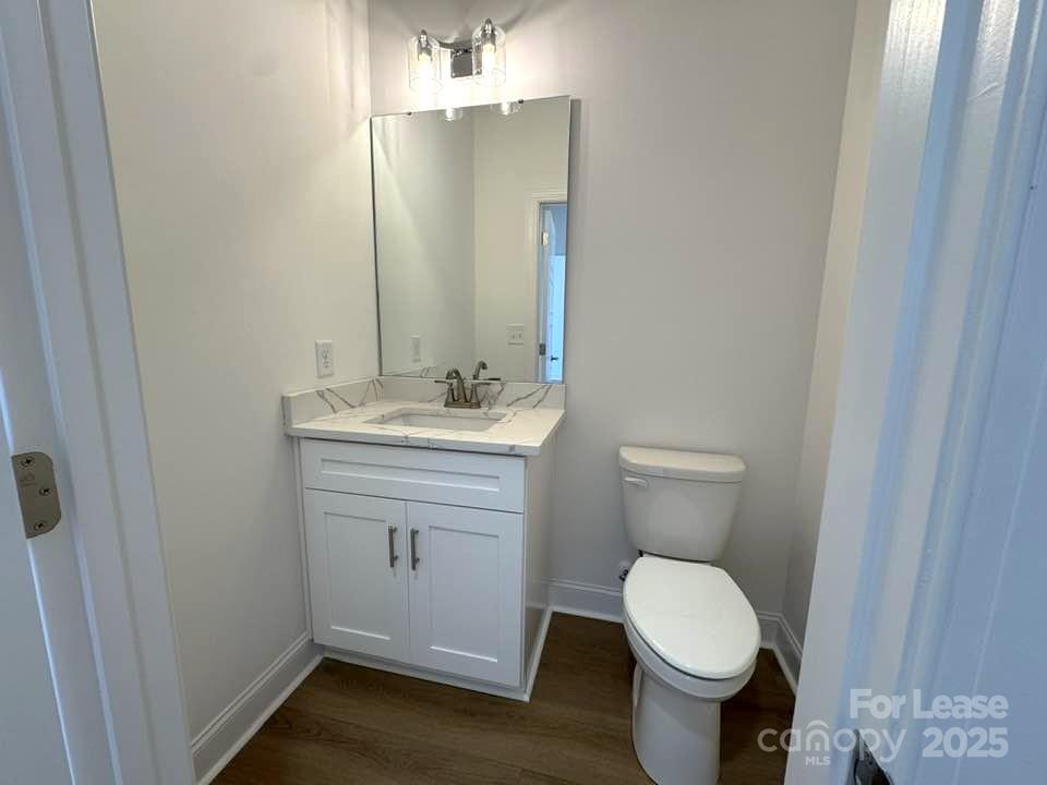 8070 Blackwood Road Denver, NC 28037 - Photo 29 of 39 a bathroom with a toilet sink and mirror