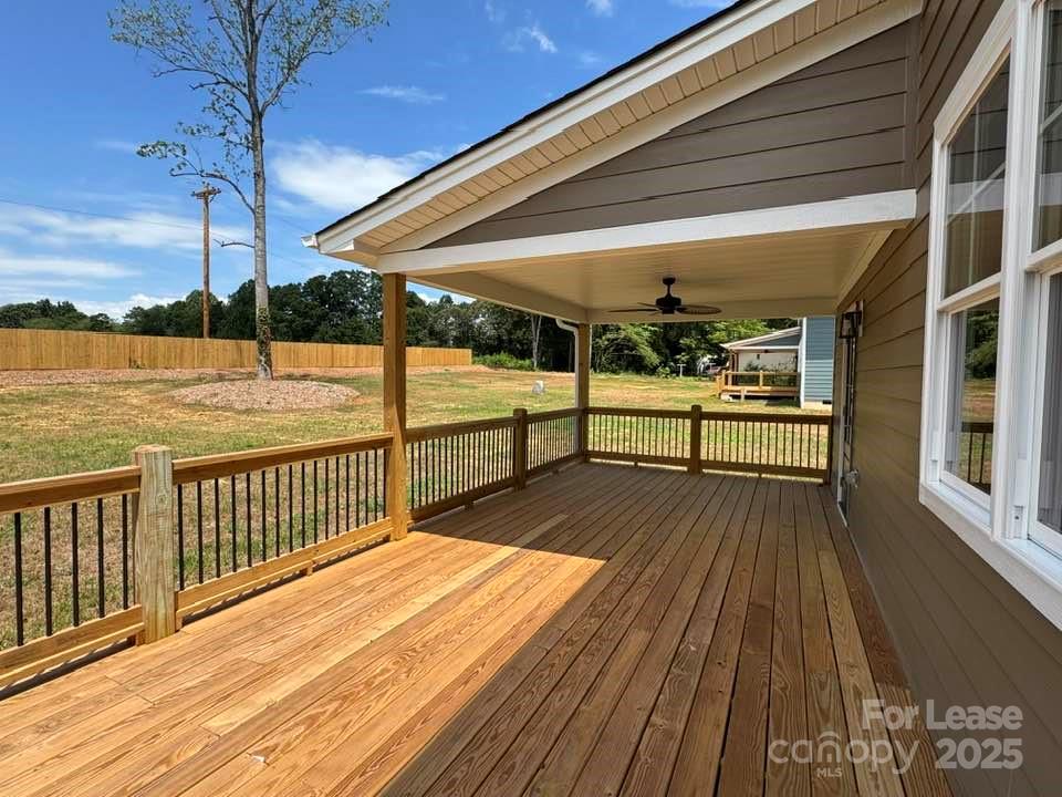8070 Blackwood Road Denver, NC 28037 - Photo 35 of 39 a view of a balcony with wooden floor and outdoor seating