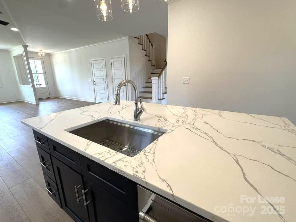 8070 Blackwood Road Denver, NC 28037 - Photo 6 of 39 a kitchen with a sink and a refrigerator