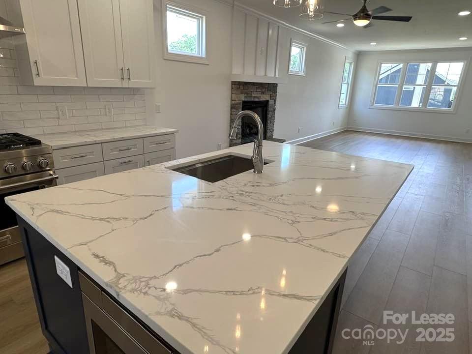 8070 Blackwood Road Denver, NC 28037 - Photo 7 of 39 a kitchen with a sink a stove and cabinets