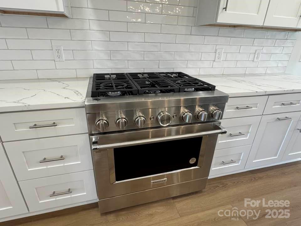 8070 Blackwood Road Denver, NC 28037 - Photo 8 of 39 a stove top oven sitting inside of a kitchen