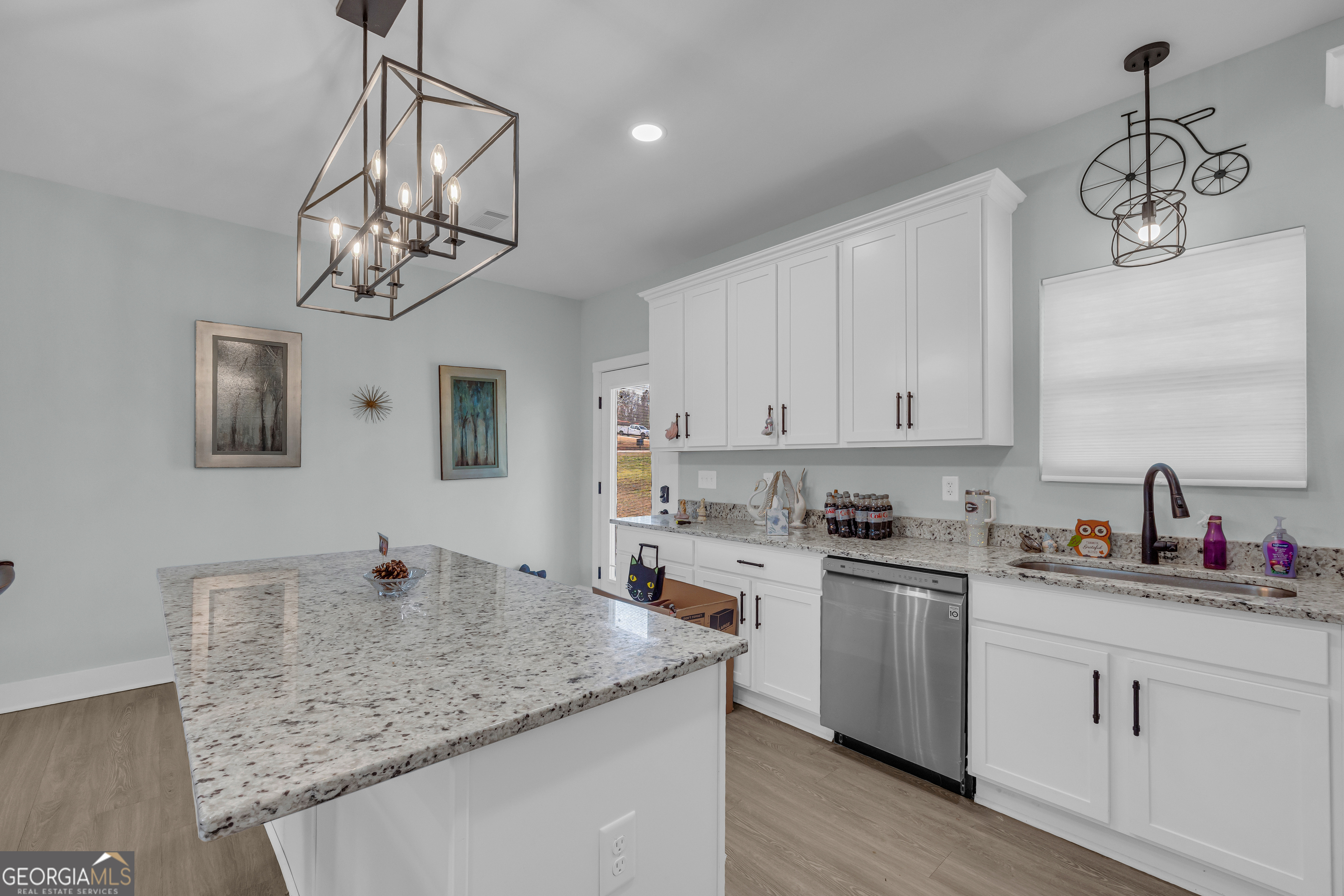 1279 South Fairview Road Lavonia, GA 30553 - Photo 13 of 43 a kitchen with cabinets and chandelier