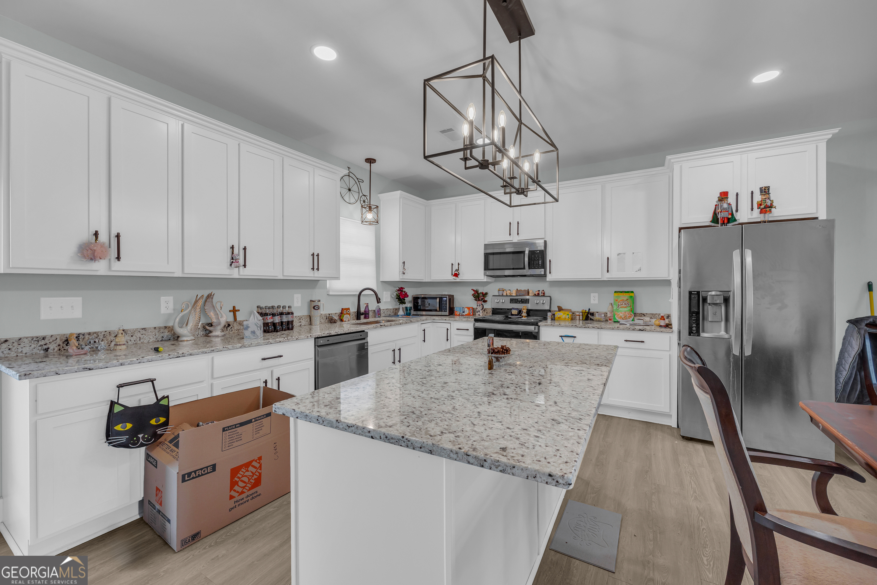 1279 South Fairview Road Lavonia, GA 30553 - Photo 17 of 43 a view of a kitchen with kitchen island a counter space a sink appliances and cabinets