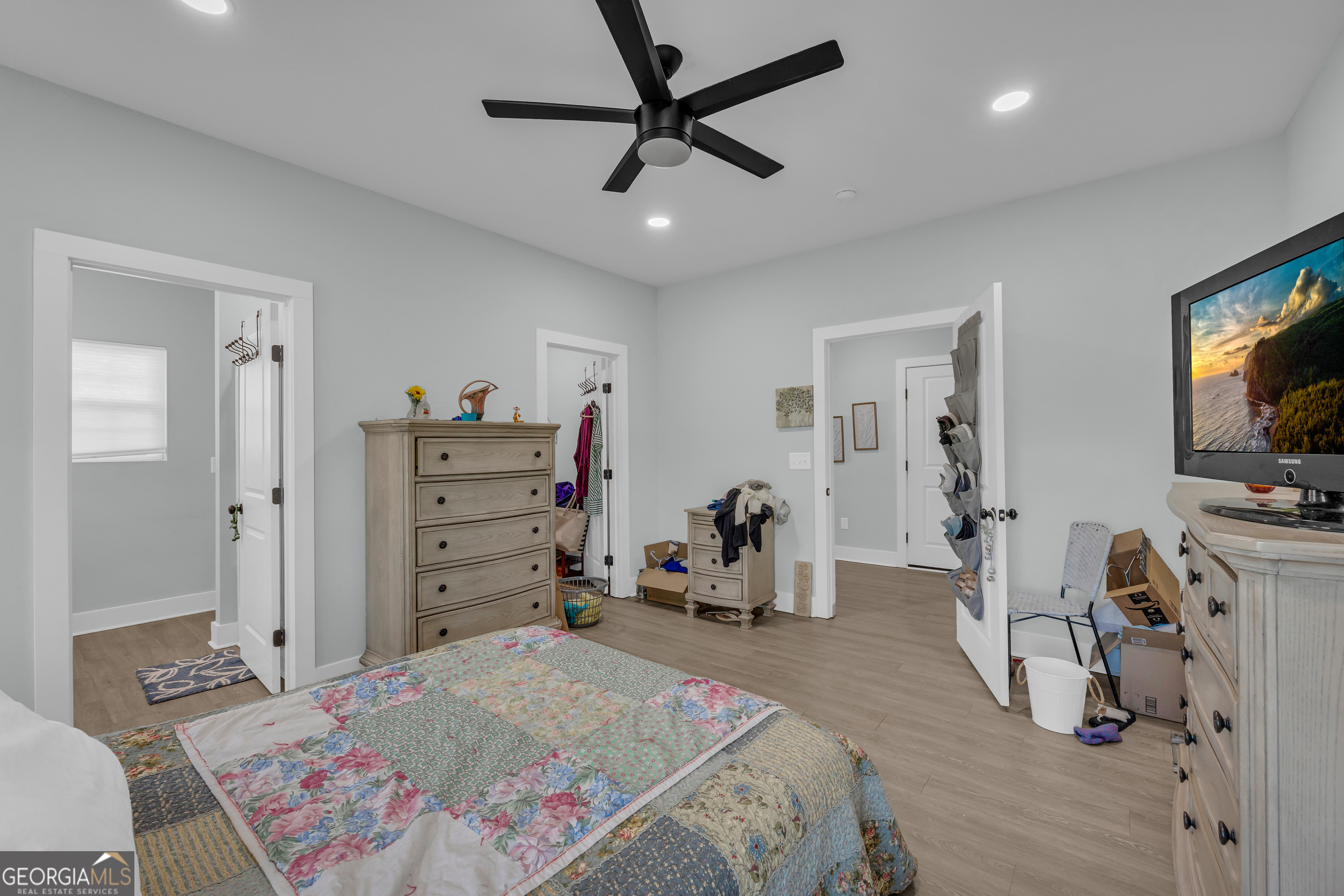 1279 South Fairview Road Lavonia, GA 30553 - Photo 30 of 43 a bedroom with a bed and a flat tv screen on dresser