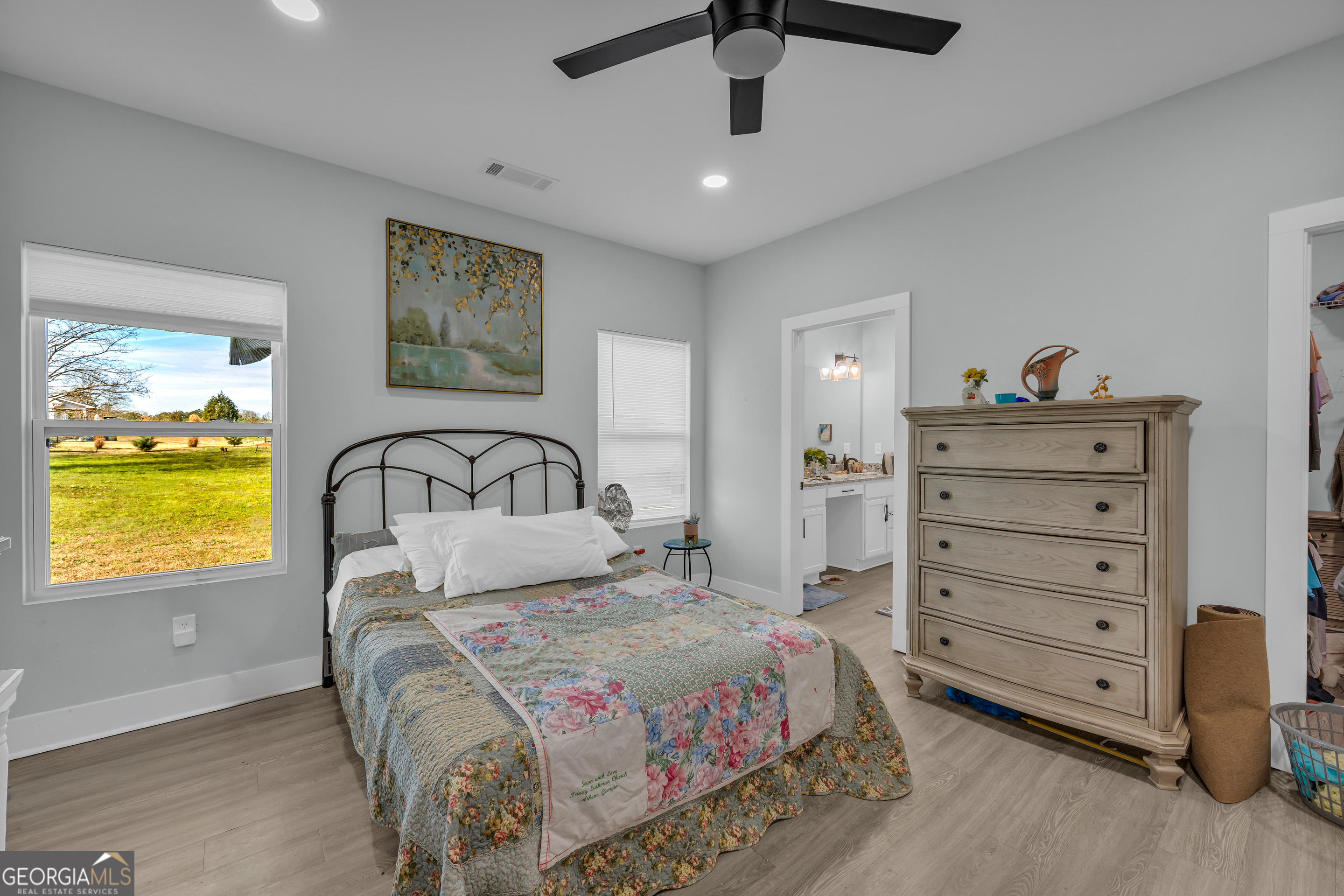 1279 South Fairview Road Lavonia, GA 30553 - Photo 31 of 43 a bedroom with a bed and a dresser