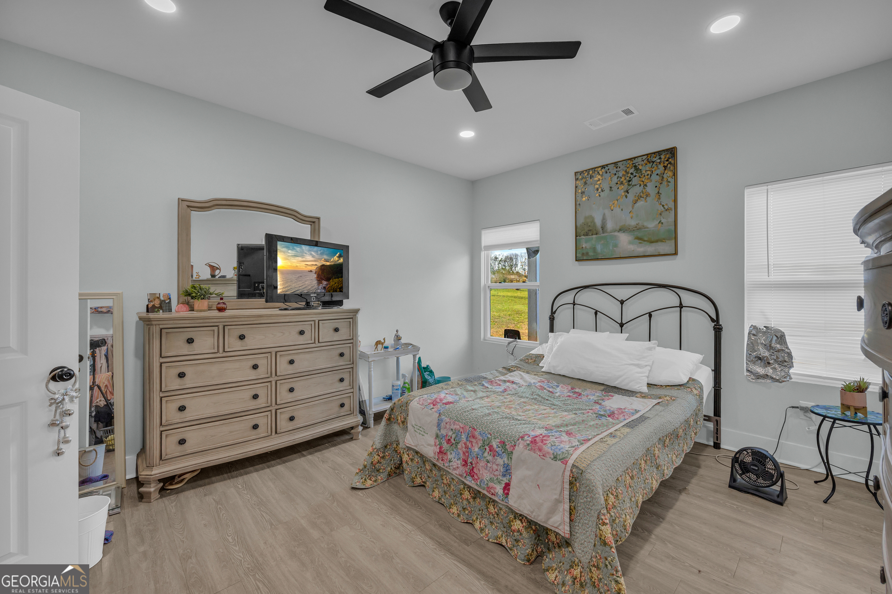 1279 South Fairview Road Lavonia, GA 30553 - Photo 34 of 43 a bedroom with a bed and a flat screen tv