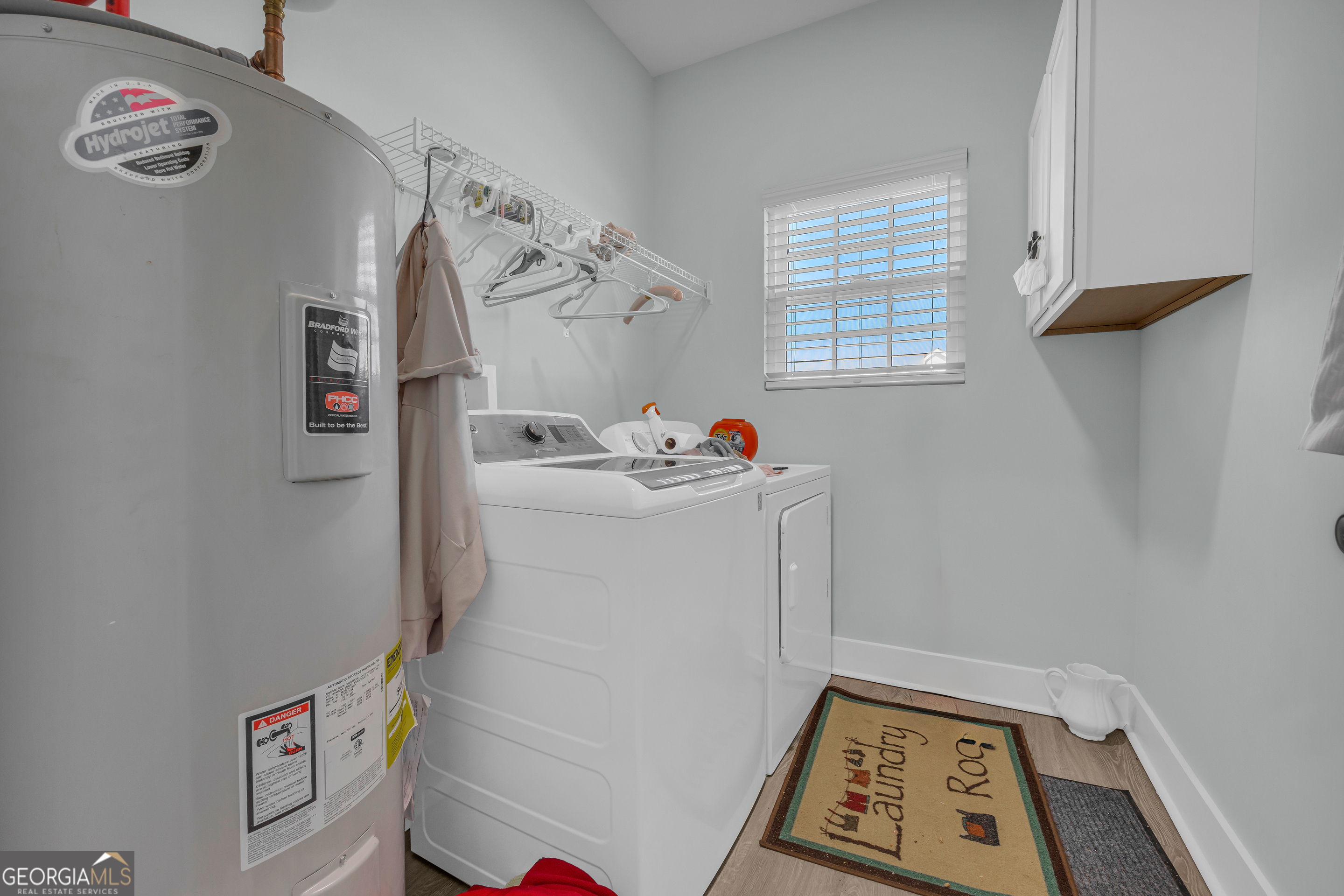1279 South Fairview Road Lavonia, GA 30553 - Photo 36 of 43 a utility room with a window dryer and washer