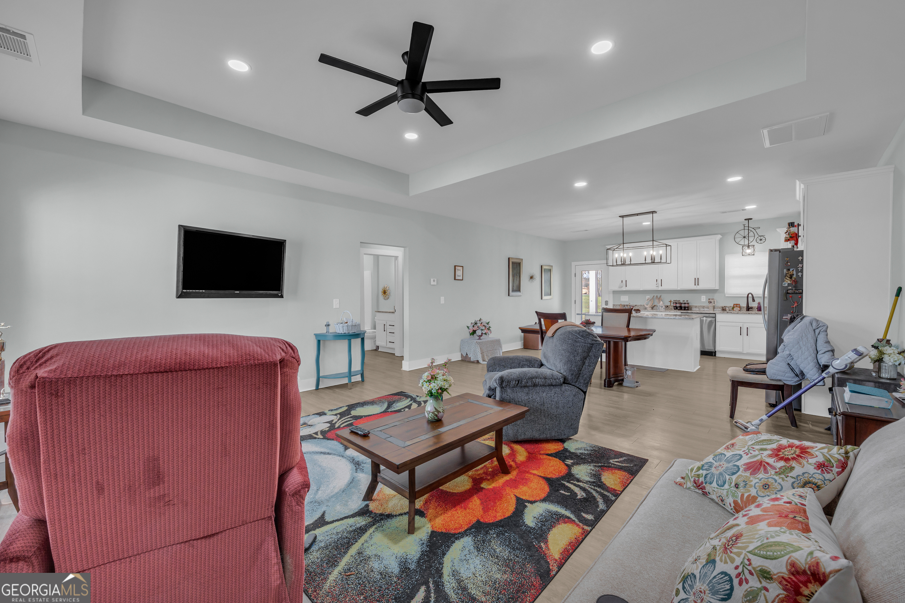 1279 South Fairview Road Lavonia, GA 30553 - Photo 10 of 43 a living room with furniture and a flat screen tv